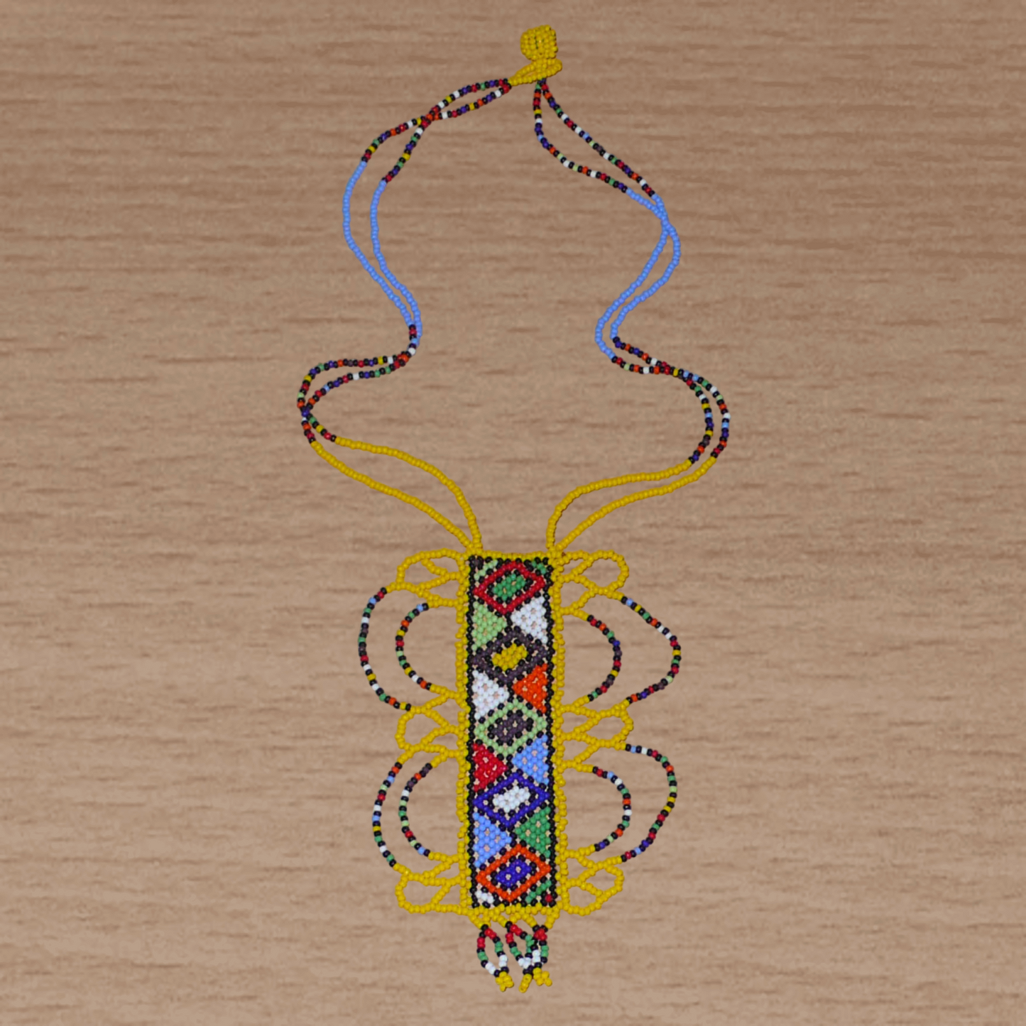 Collier sud-africain jaune orné d'un long pendentif fantaisie décoré de motifs ethniques zoulous multicolores ; il se compose de perles de rocaille et s'attache avec un fermoir à boule.